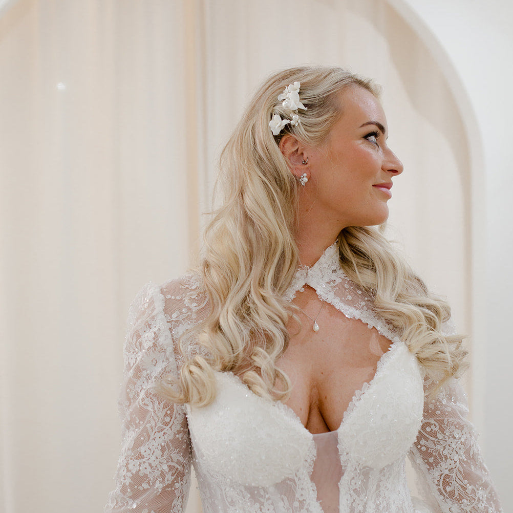 Ceramic floral bridal hair pins with pearl details.