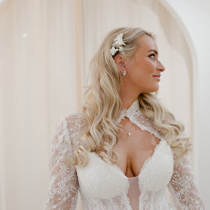 Ceramic floral bridal hair pins with pearl details.