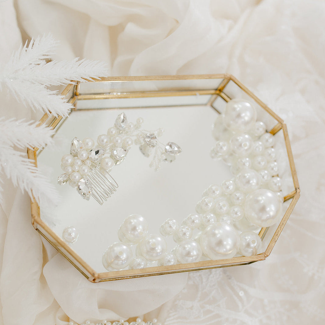 Pearl and crystal bridal hair comb featuring clustered ivory pearls and clear bead detailing for an elegant, organic finish.