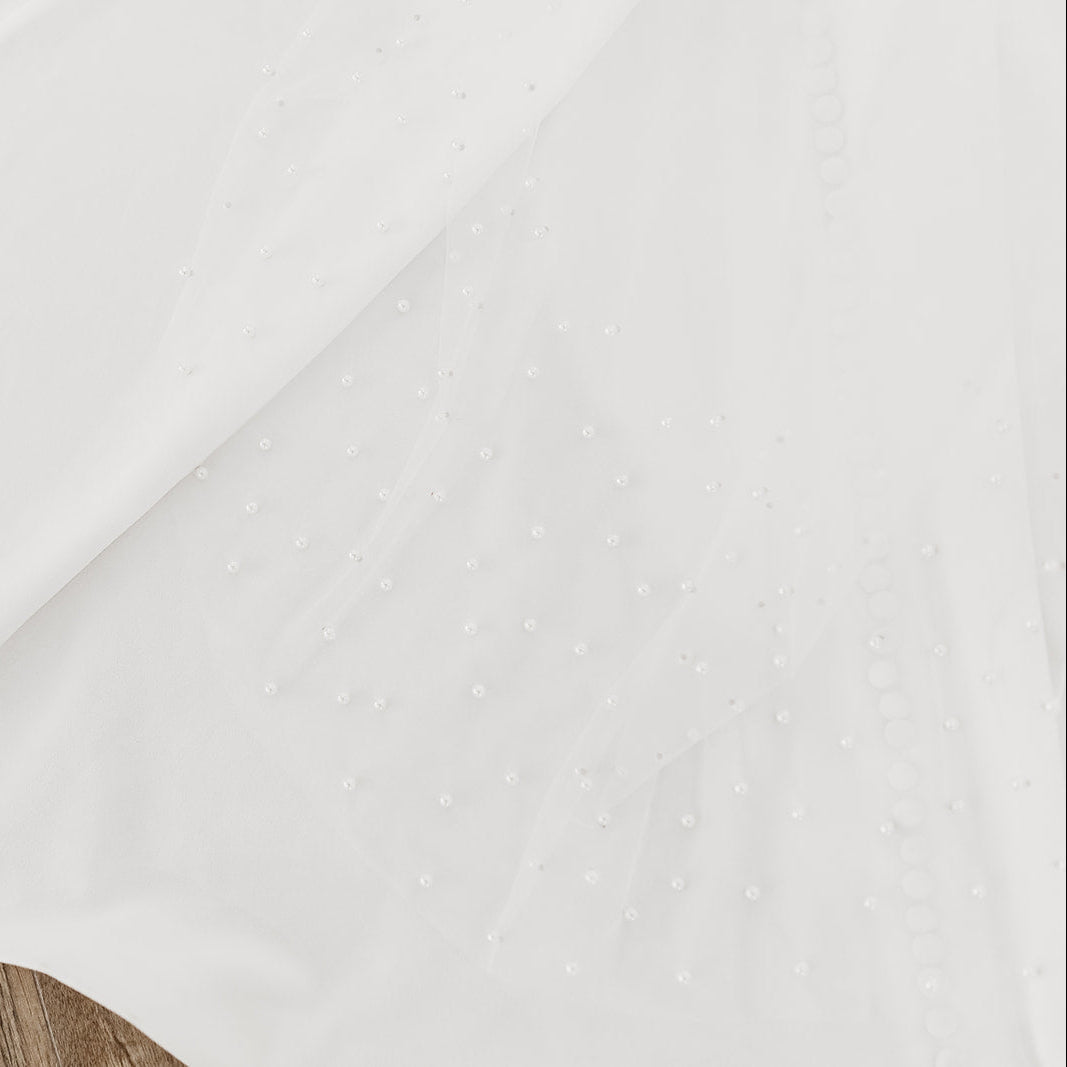 Sheer single tier bridal veil adorned with scattered ivory pearls along the edge.