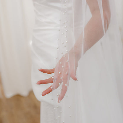 Sheer single tier bridal veil adorned with scattered ivory pearls along the edge.