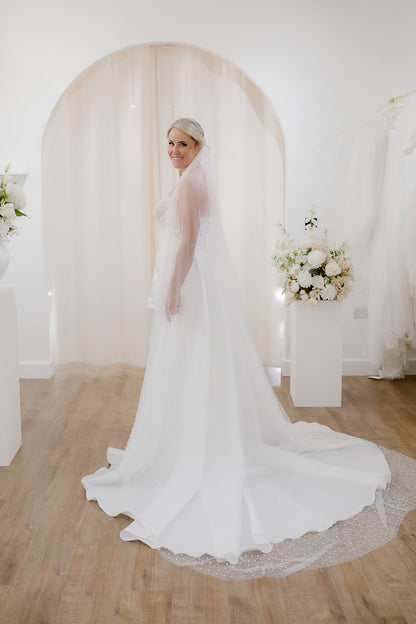 Sheer single tier bridal veil adorned with scattered ivory pearls along the edge.