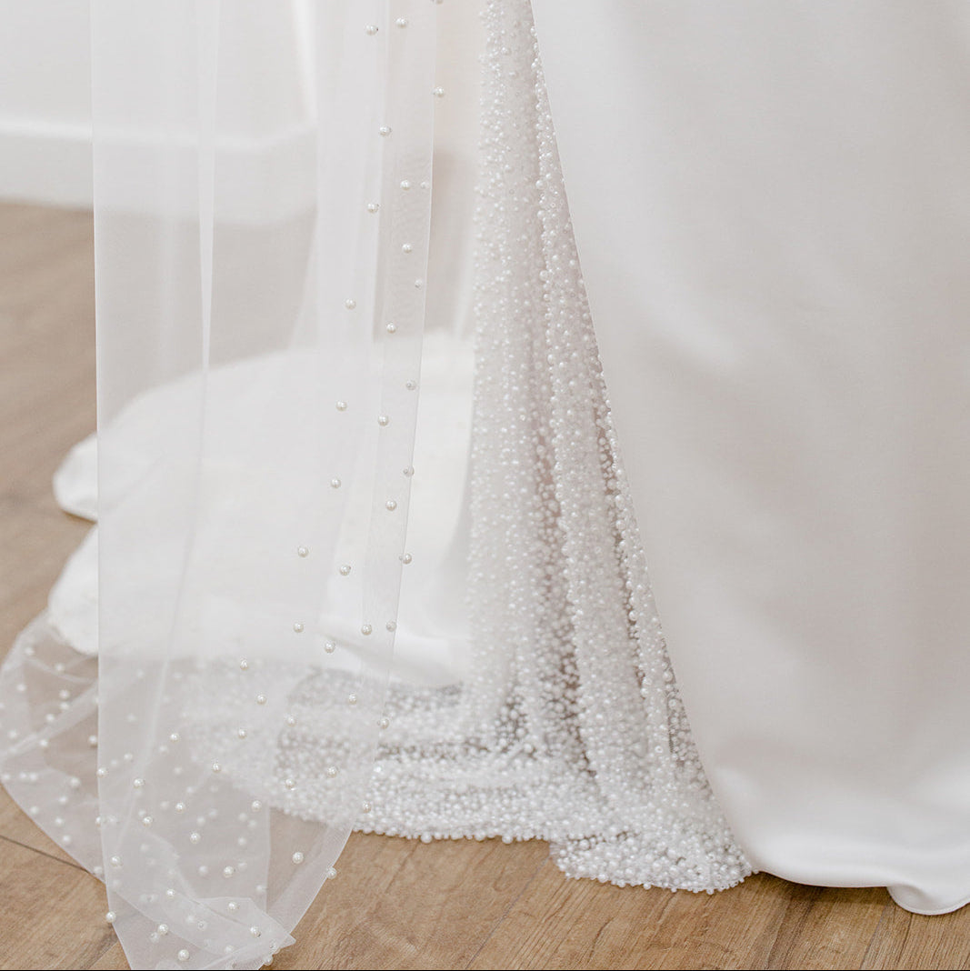 Sheer single tier bridal veil adorned with scattered ivory pearls along the edge.
