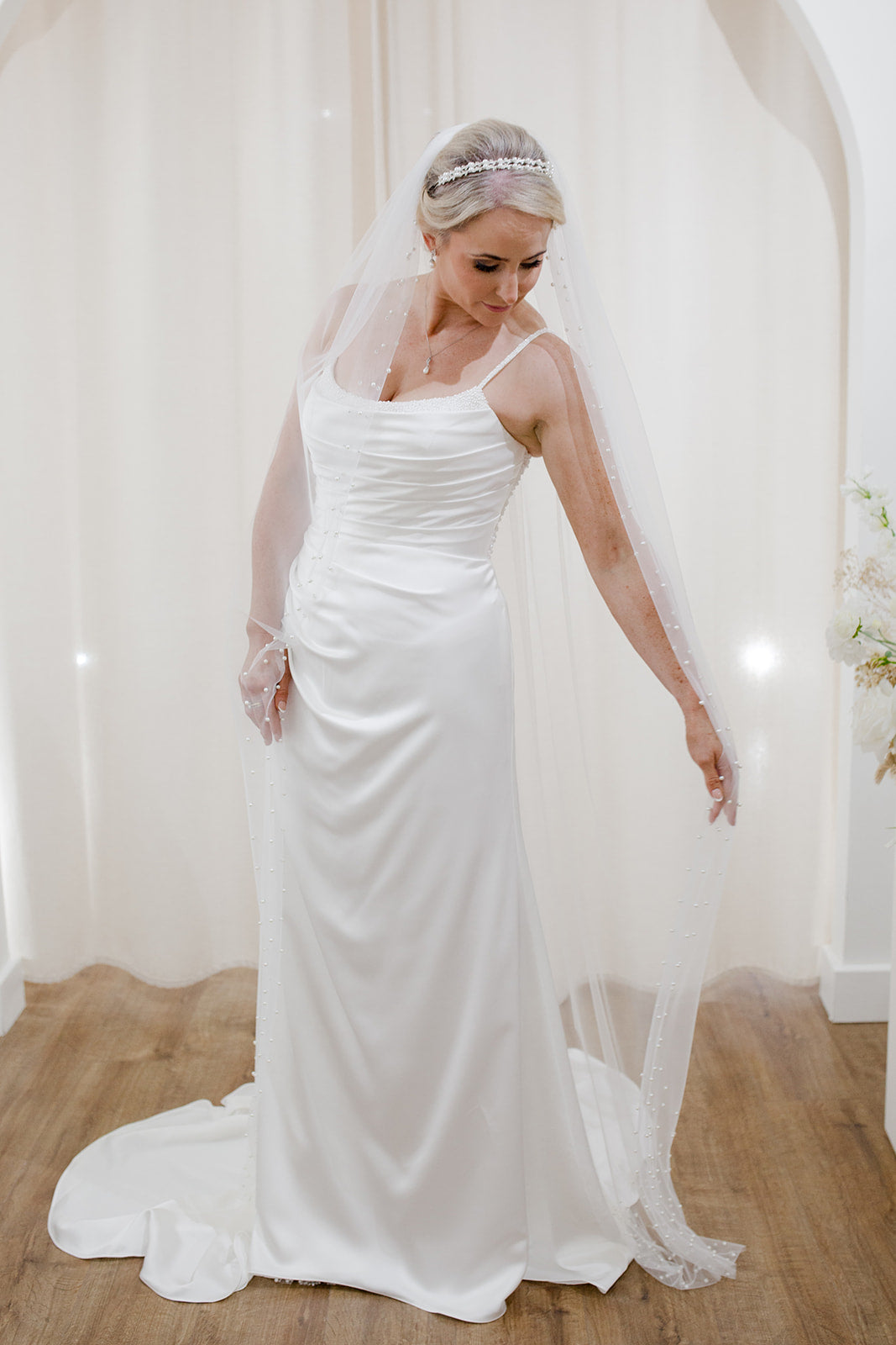 Sheer single tier bridal veil adorned with scattered ivory pearls along the edge.