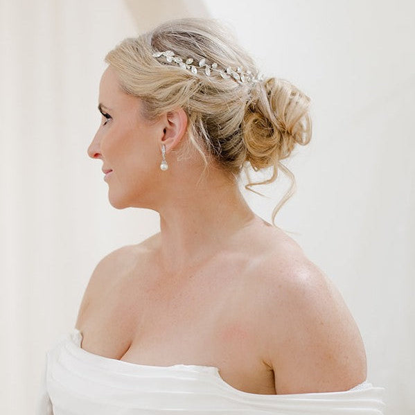 Bride with silver crystal hair vine accessory
