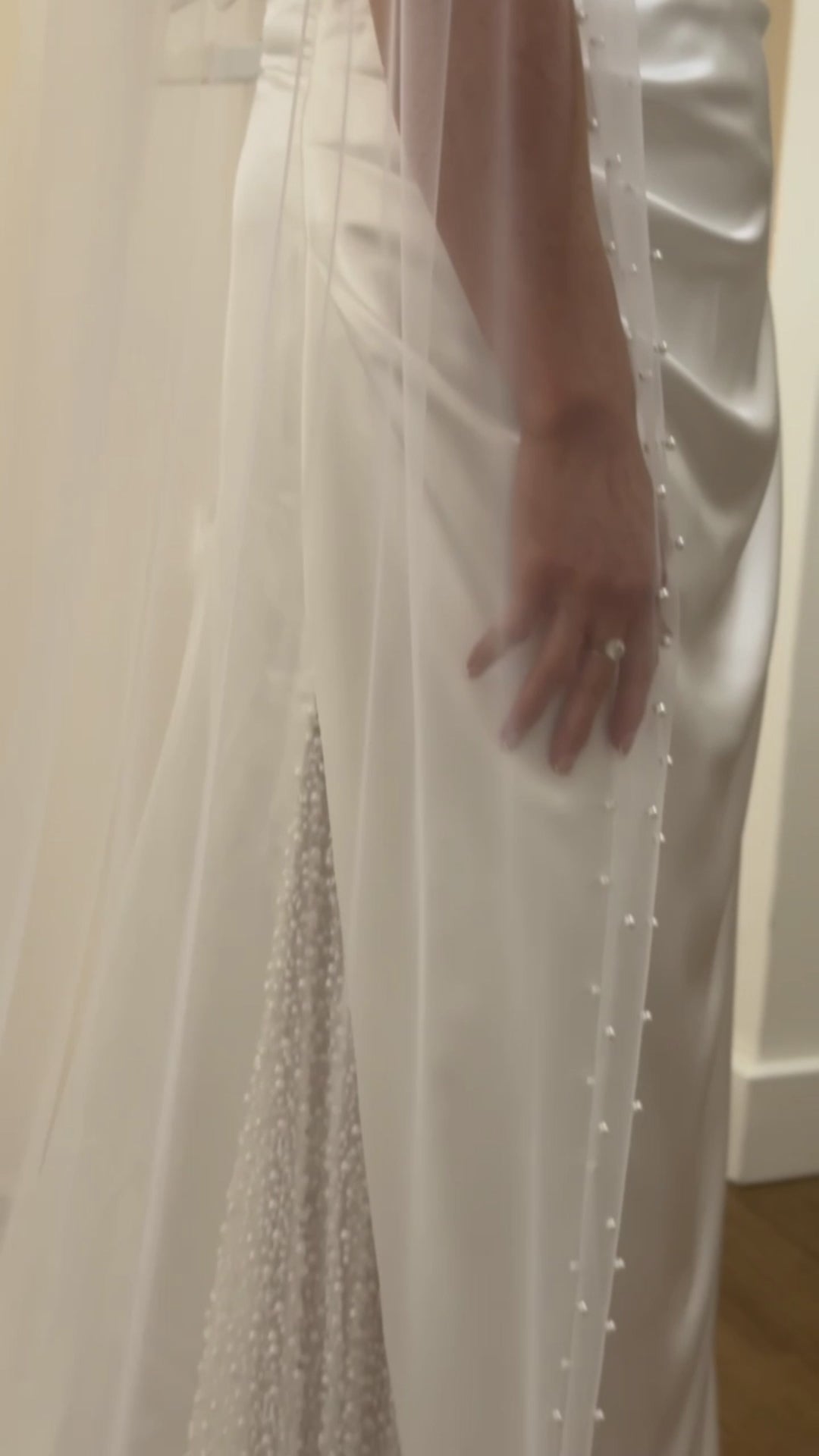 Sheer single tier bridal veil adorned with scattered ivory pearls along the edge.